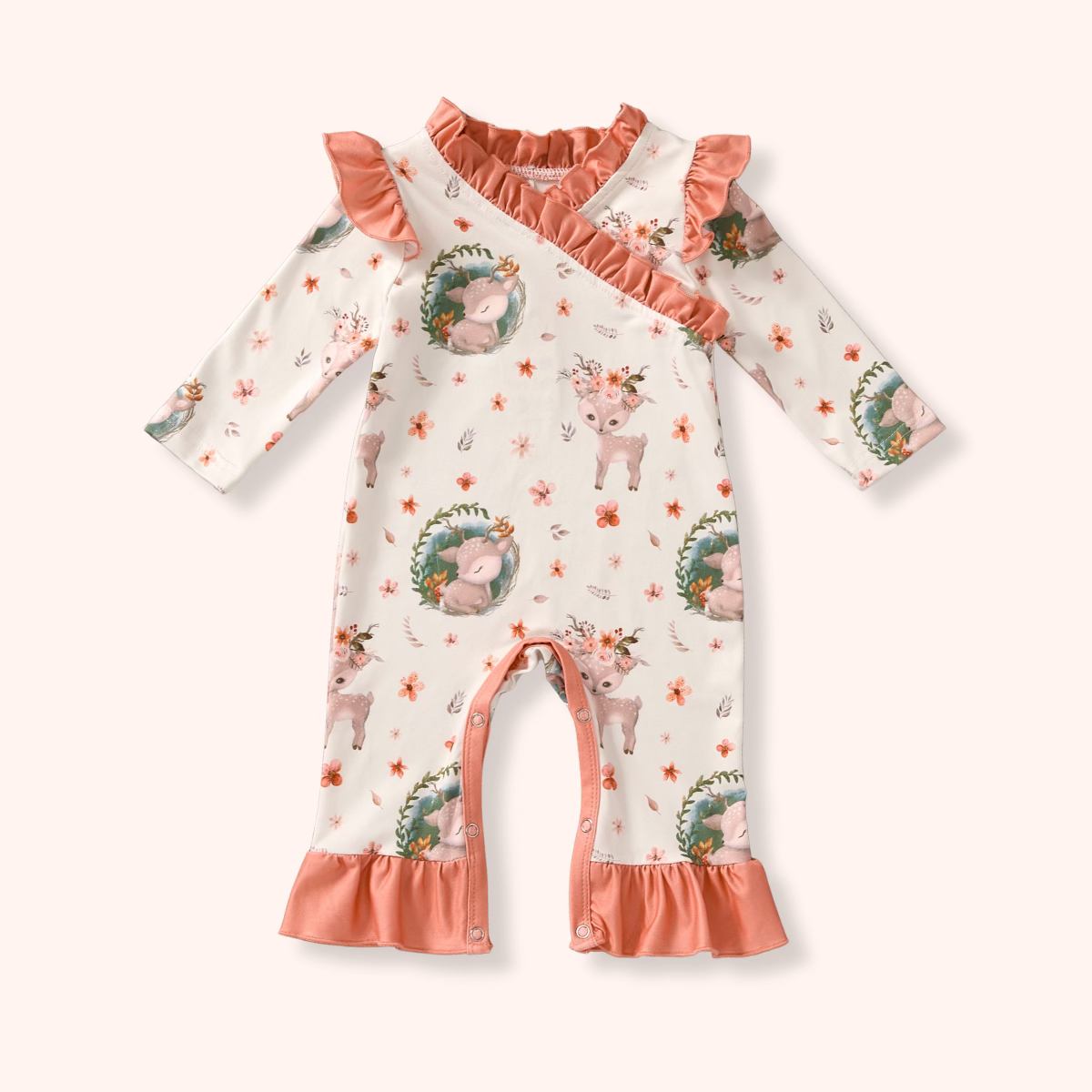 Baby romper with floral and animal pattern on a white background